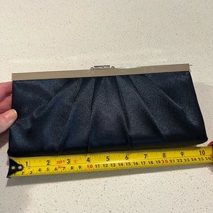 Navy blue satin evening bag. Clasp closure.  Optional Chain shoulder strap.